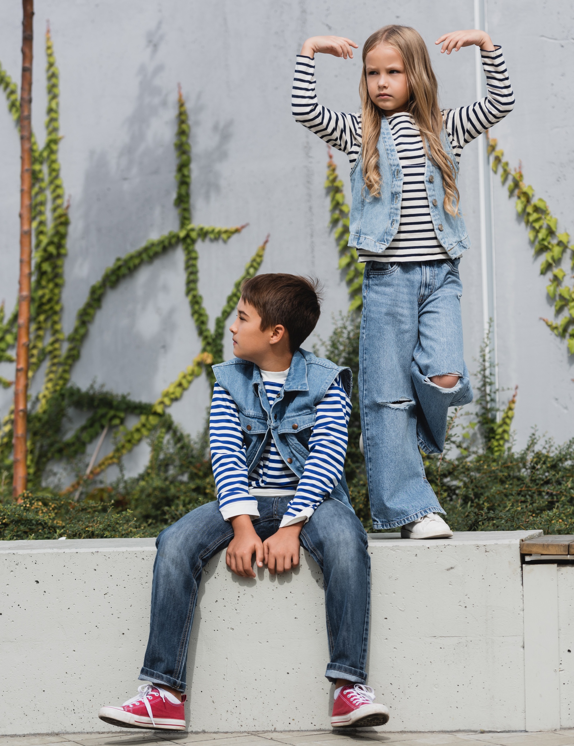 6 full-length-girl-stylish-clothes-posing-near-well-dressed-boy-shopping-mall-building.jpg