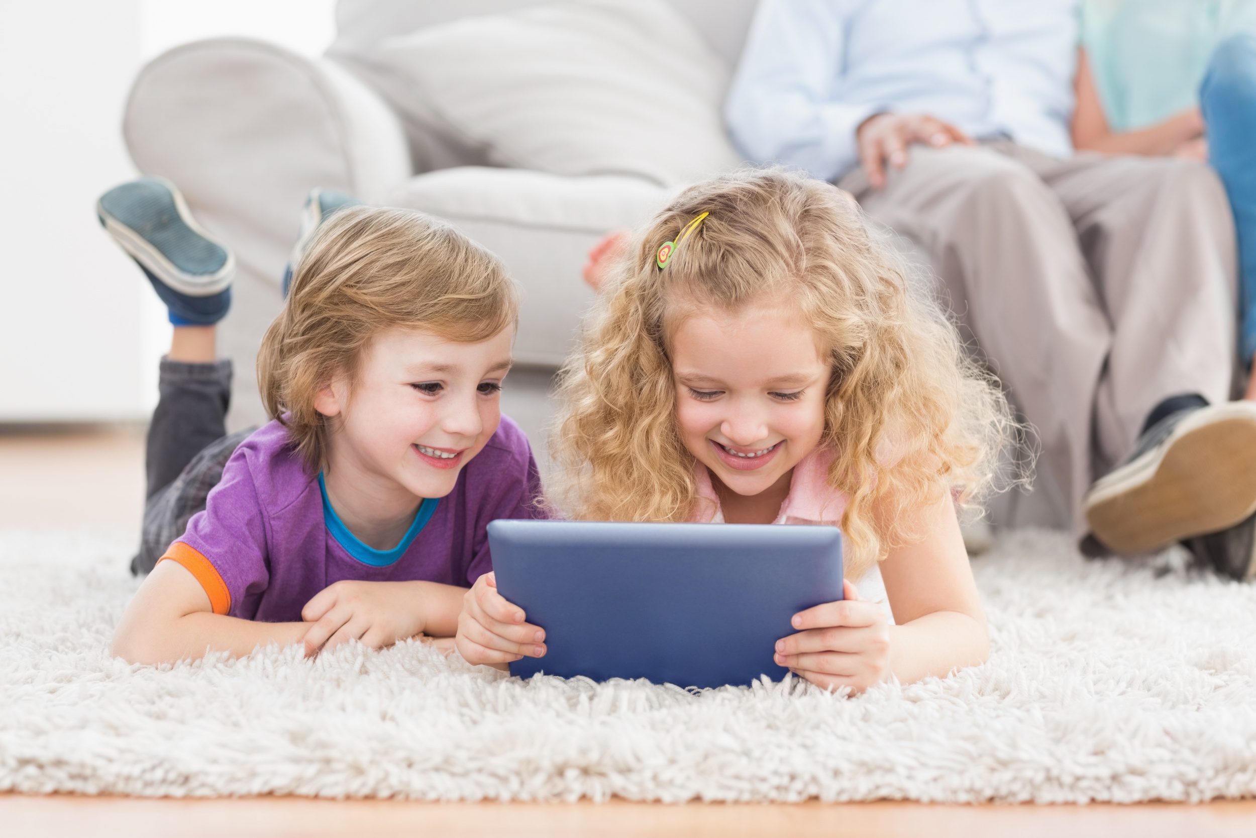 1 brother-sister-using-digital-tablet-rug.jpg