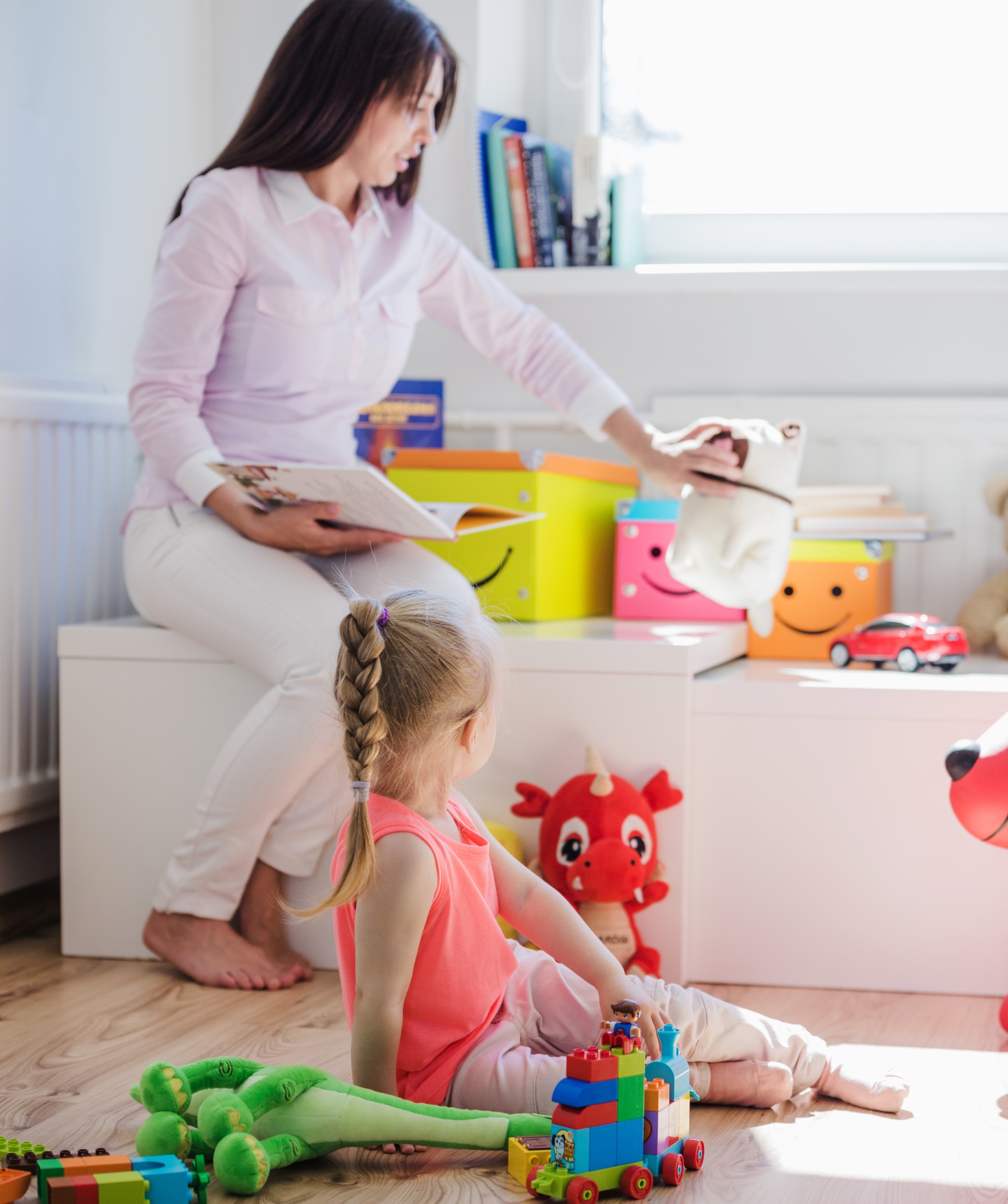 02 woman-playing-with-child-playroom.jpg