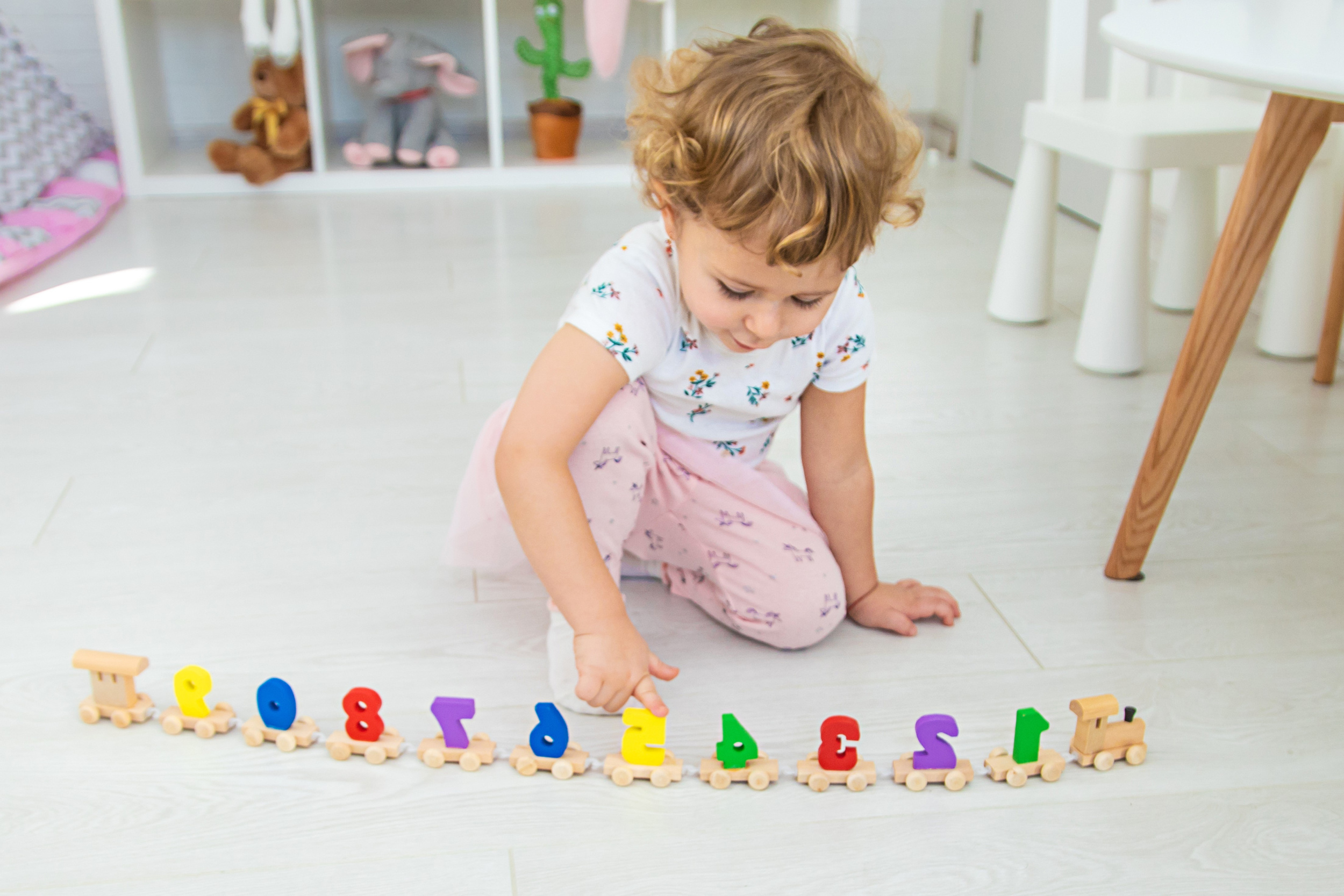 a-child-plays-with-a-train-made-of-numbers-selective-focus.jpg