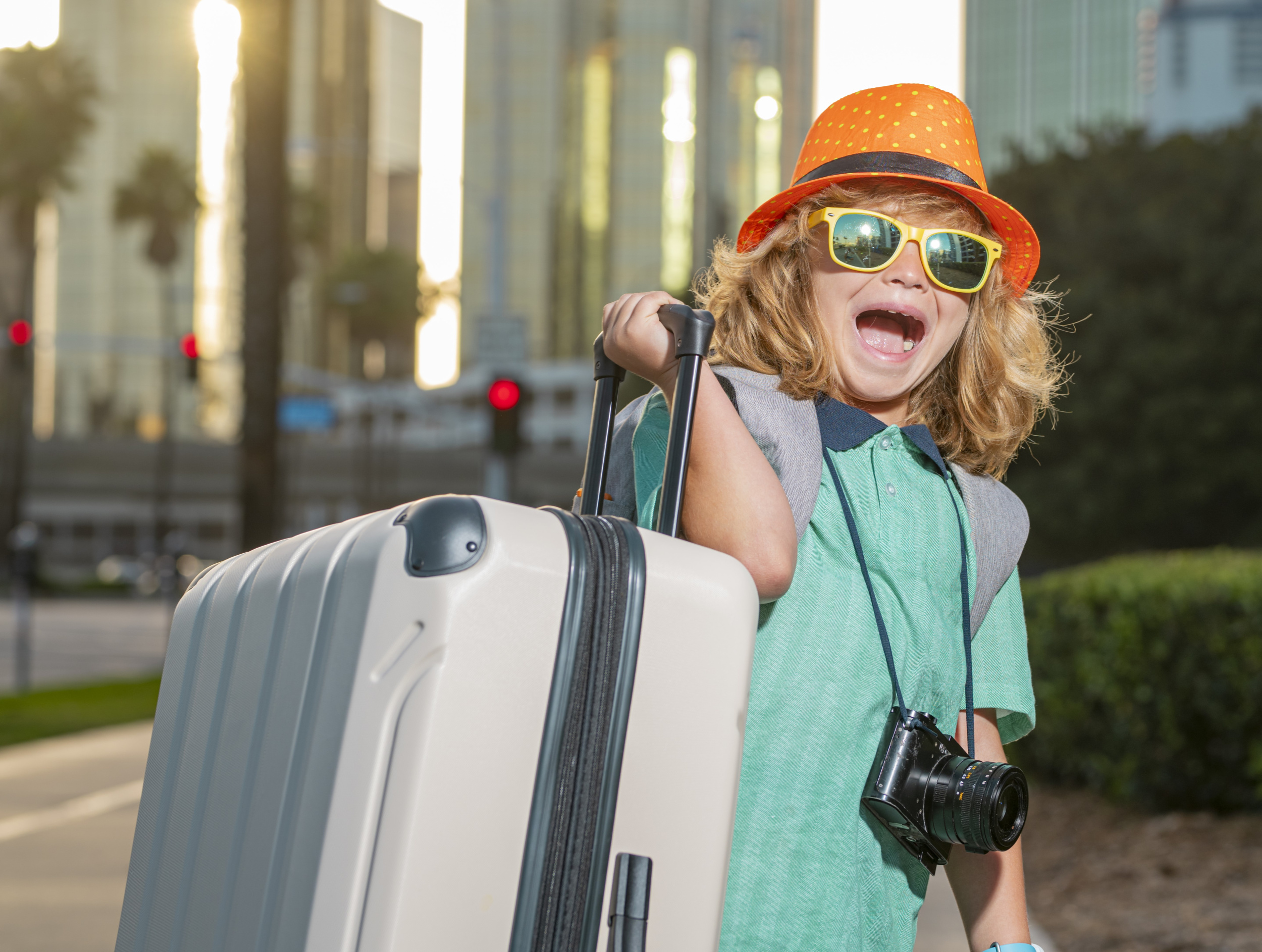 7- portrait-modern-child-boy-with-luggage-suitcases-going-vacations-kids-travel-lifestyle-little-boy-tourist-walking-city-street-traveler-tourist-kid-casual-clothes-hat-hold.jpg