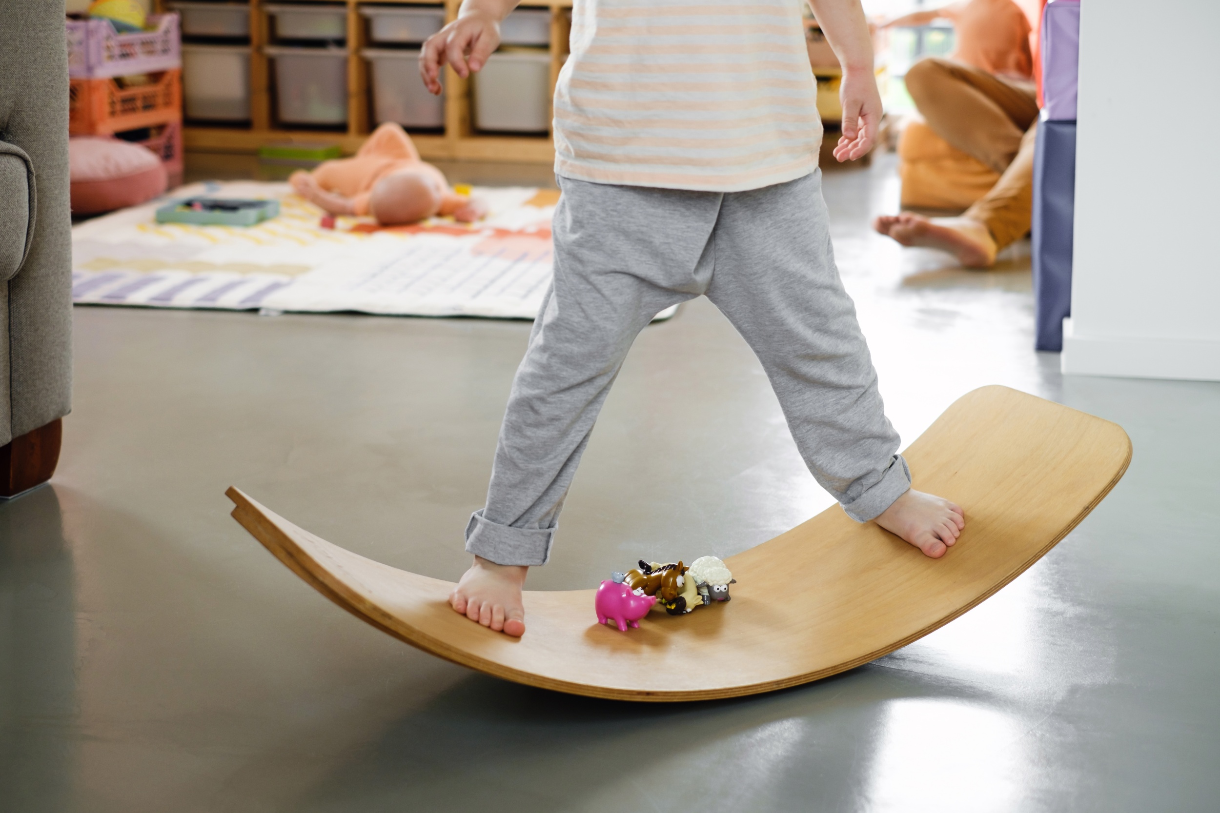 2 children-playing-balance-board-toddlers-kids-room.jpg
