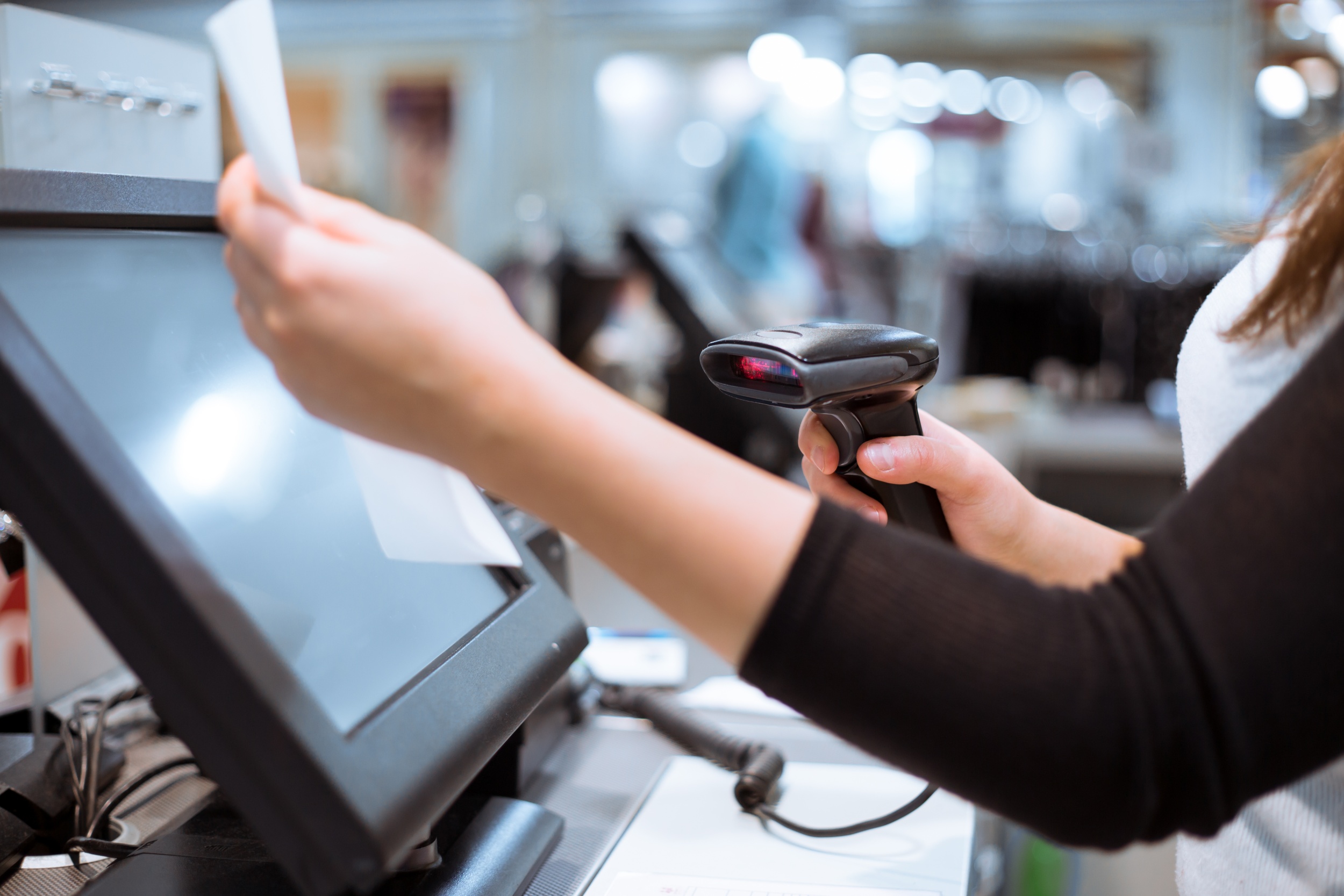 2 young-woman-hands-scaning-entering-discount-sale-receipt-touchscreen-cash-register-market-shop.jpg