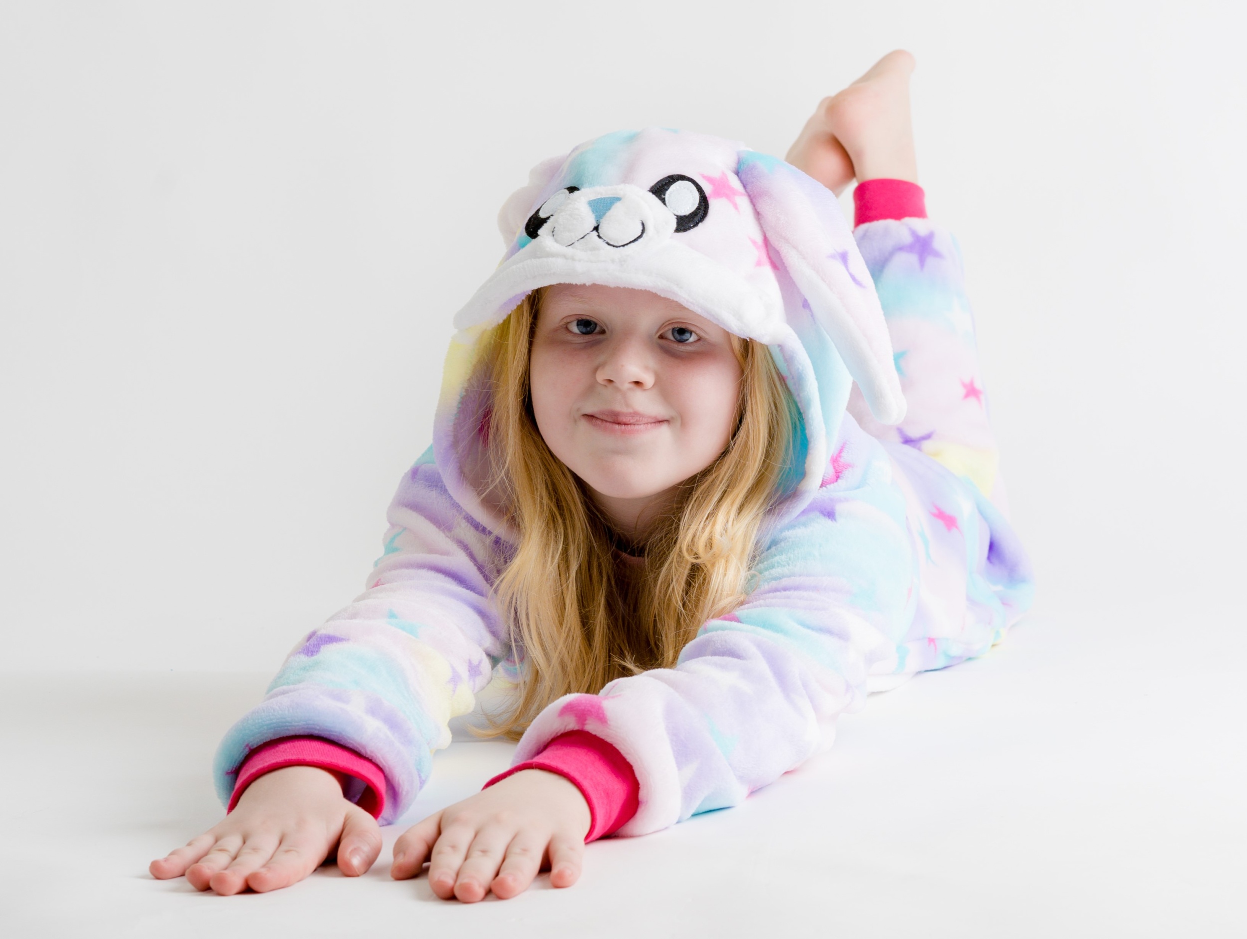 02 portrait-cute-smiling-girl-lying-white-background.jpg