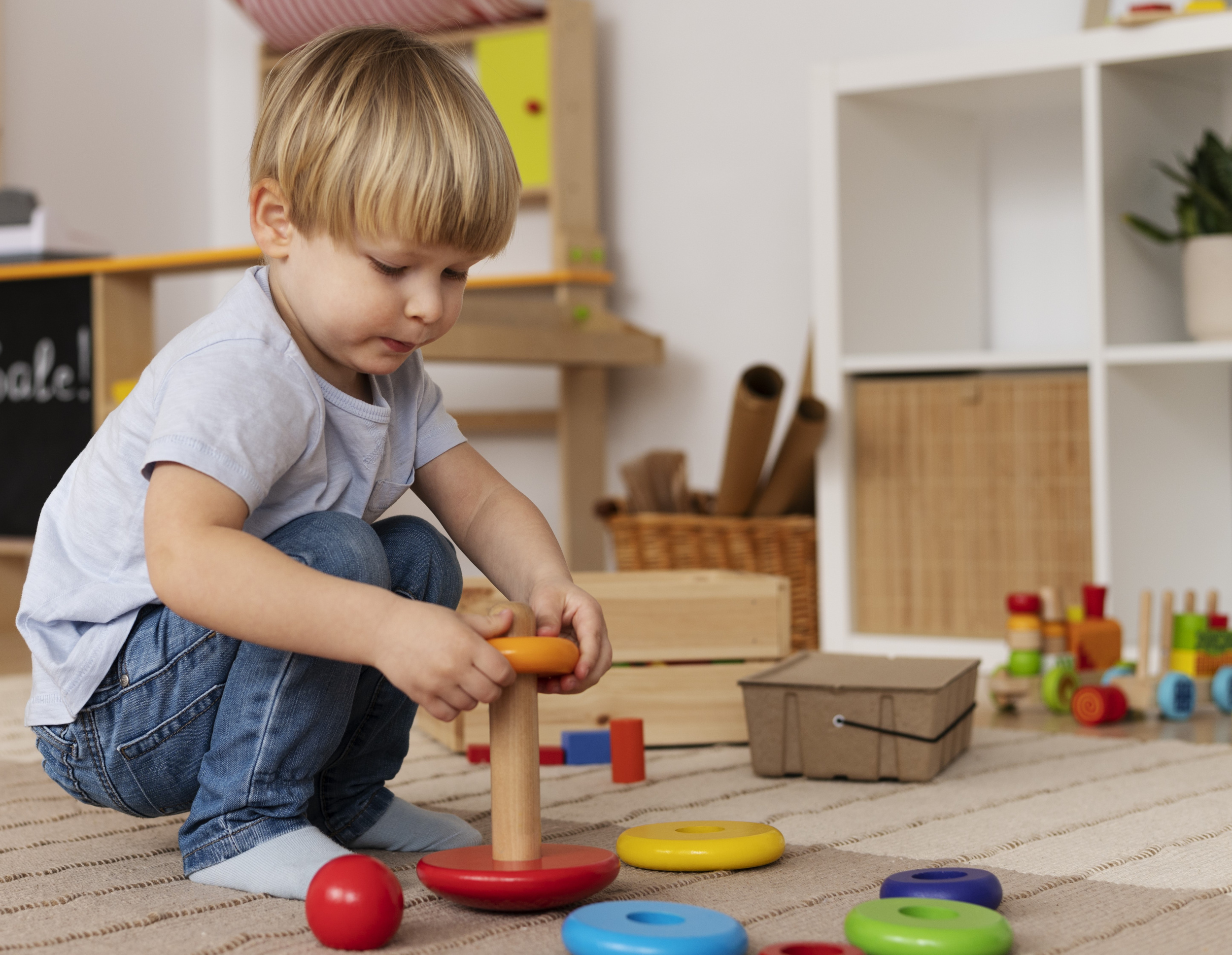 2 - full-shot-cute-kid-playing-with-wooden-toy.jpg