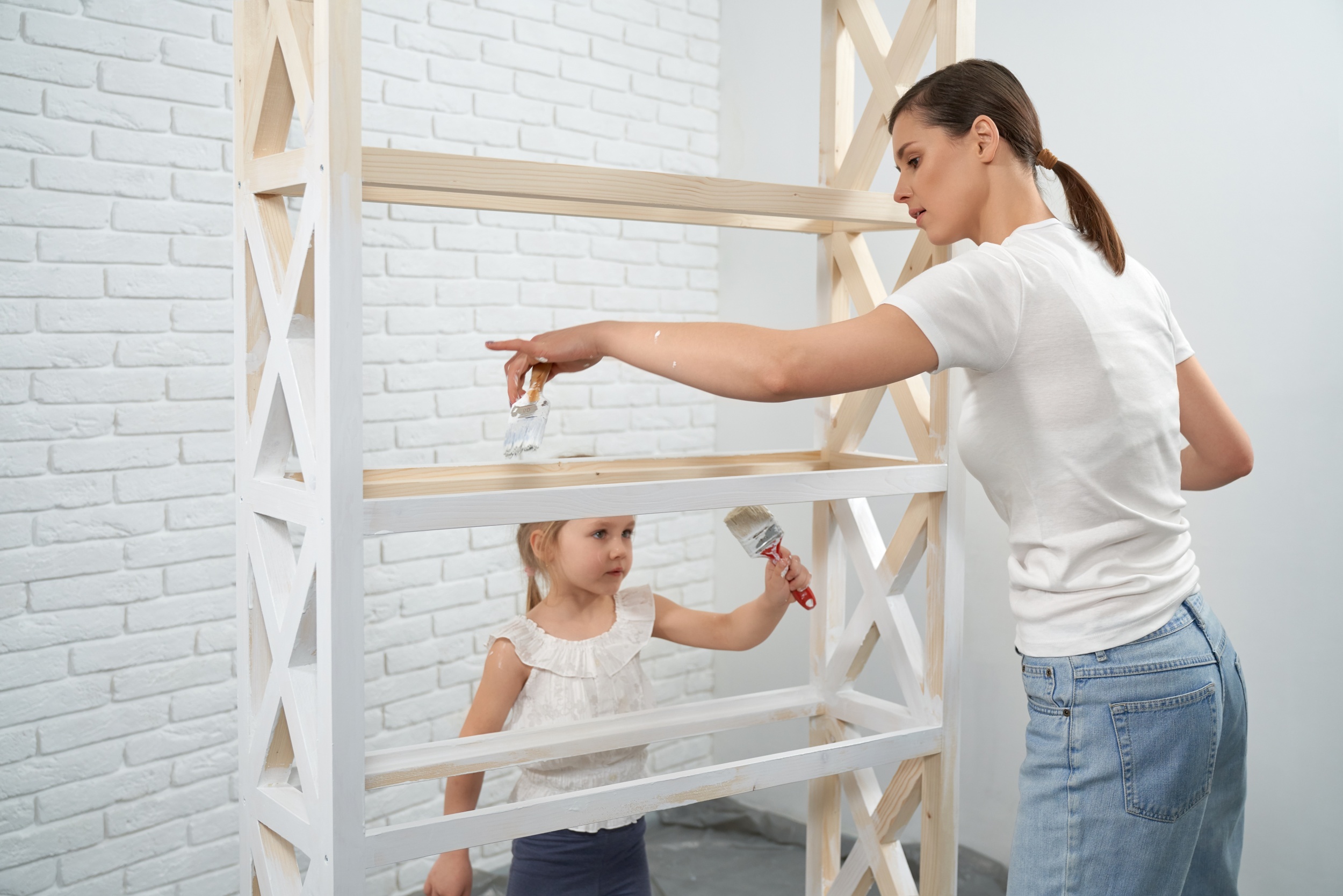 2 woman-with-daughter-painting-wooden-rack.jpg