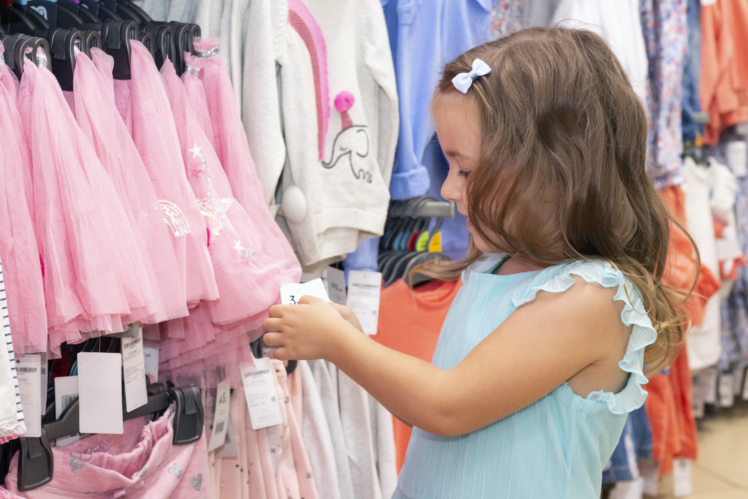 4 girl-chooses-clothes-clothing-store.jpg
