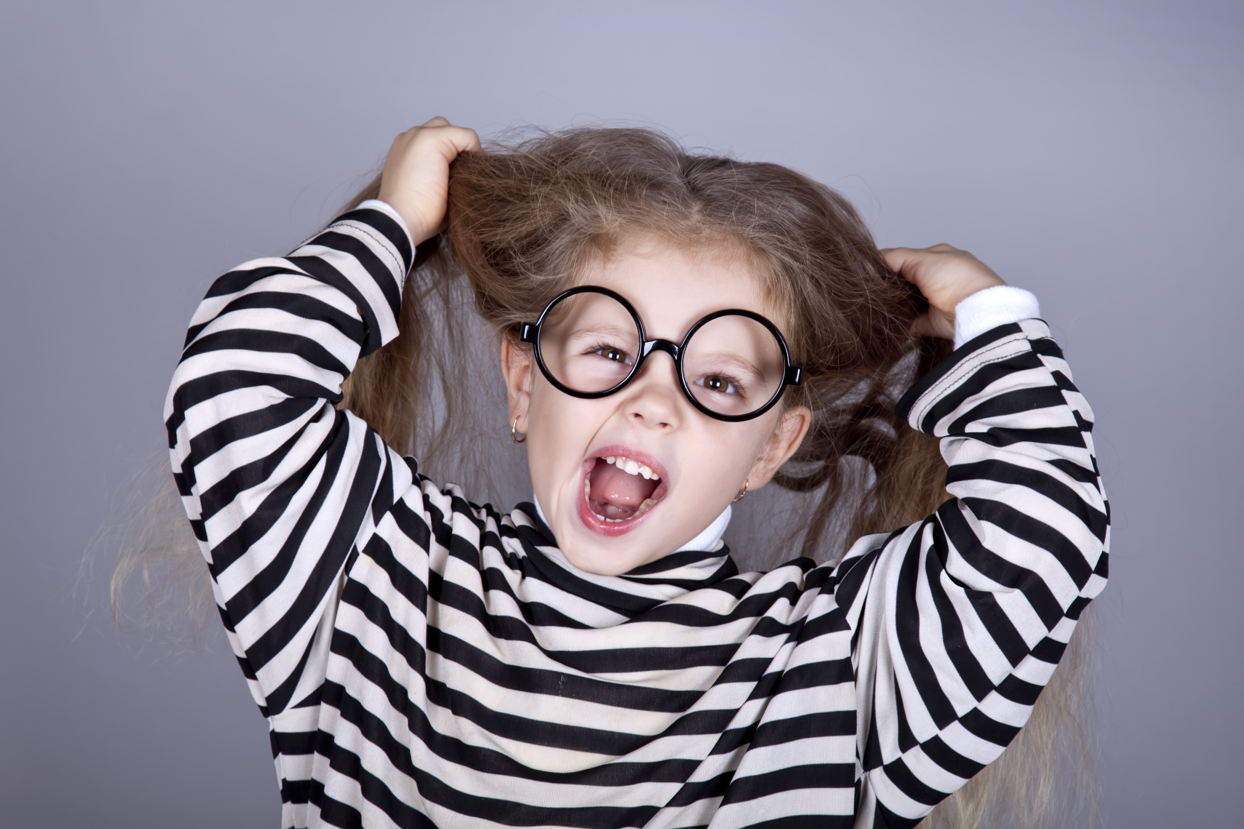 6 young-shouting-child-glasses-striped-knitted-jacket.jpg