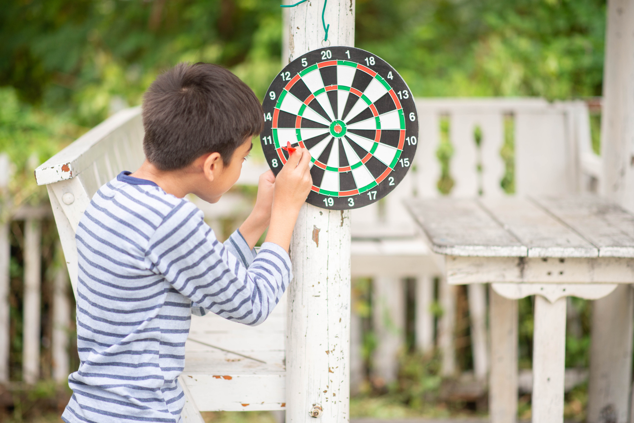 1 little-boy-playing-darts-board-family-outdoor-activity (1).jpg