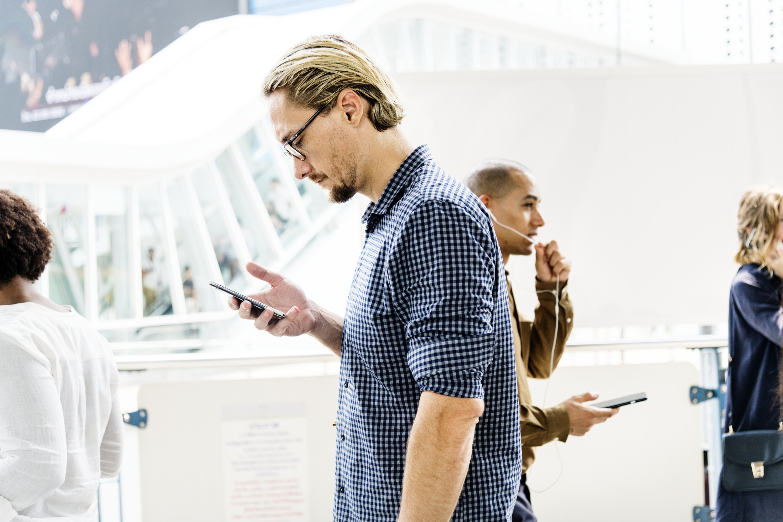 2 blond-man-texting-his-phone.jpg