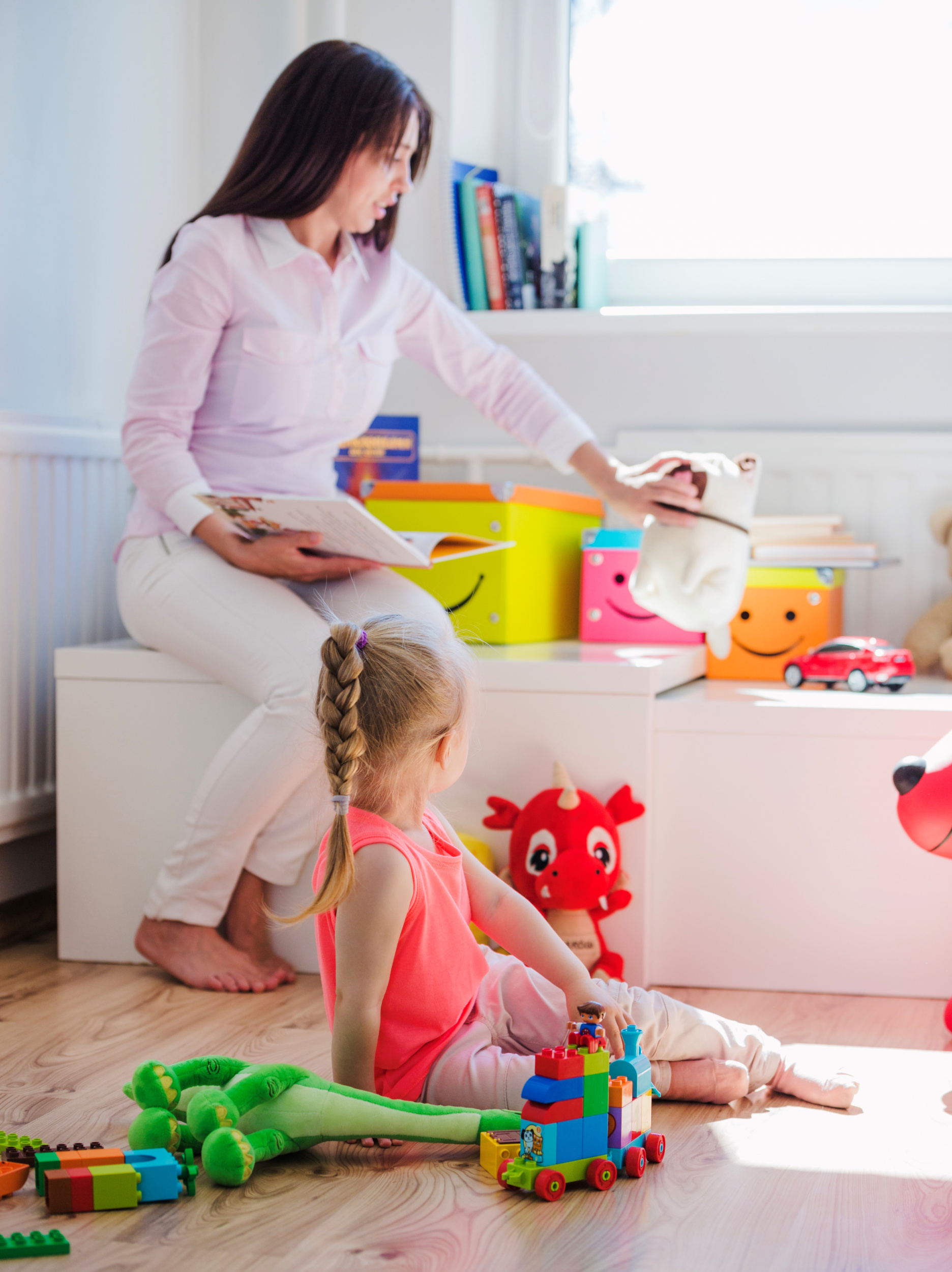 woman-playing-with-child-in-playroom.jpg