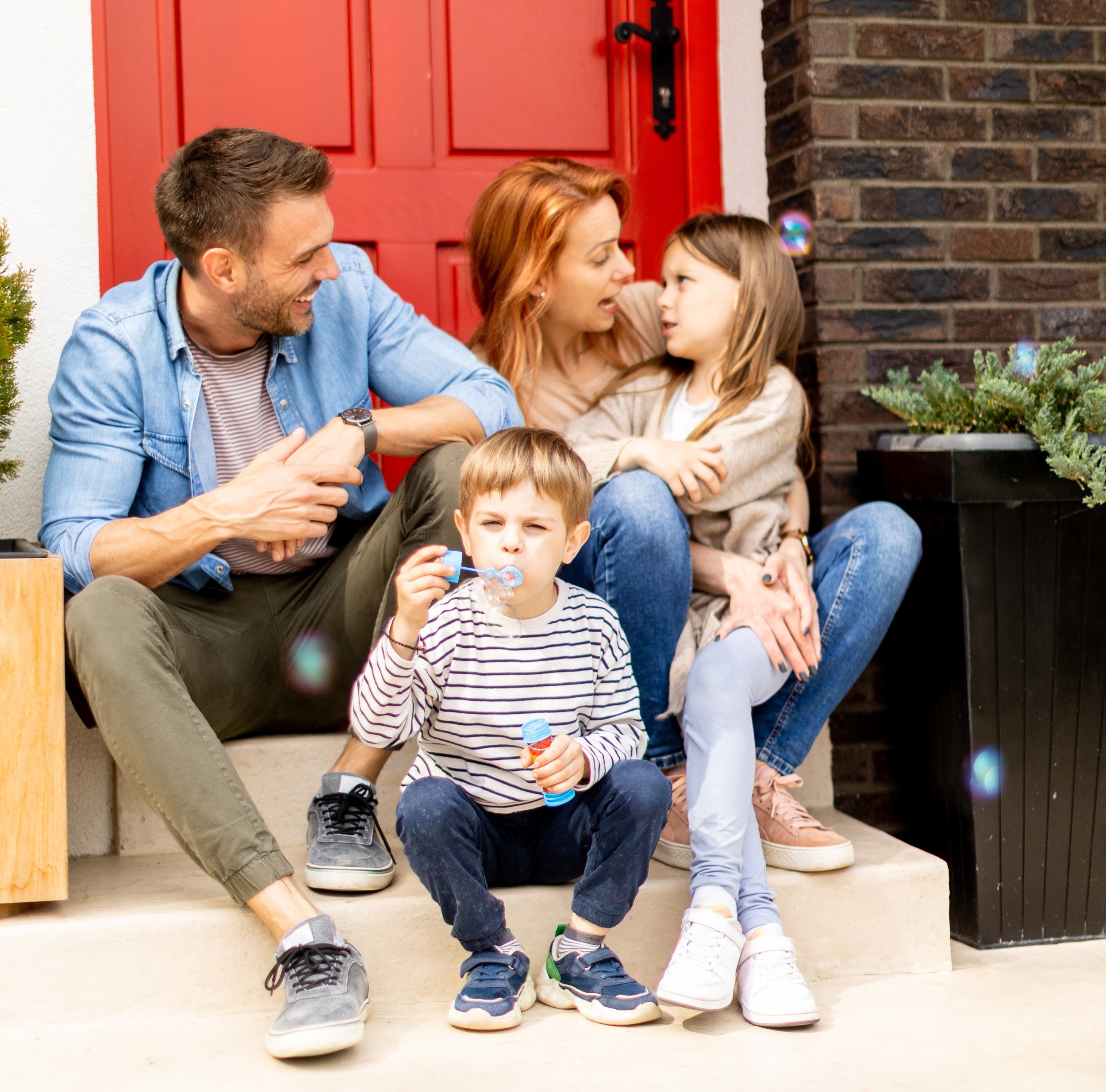 3 family-with-mother-father-son-daughter-sitting-outside-steps-front-porch-brick-house.jpg 3 family-with-mother-father-son-daughter-sitting-outside-steps-front-porch-brick-house.jpg