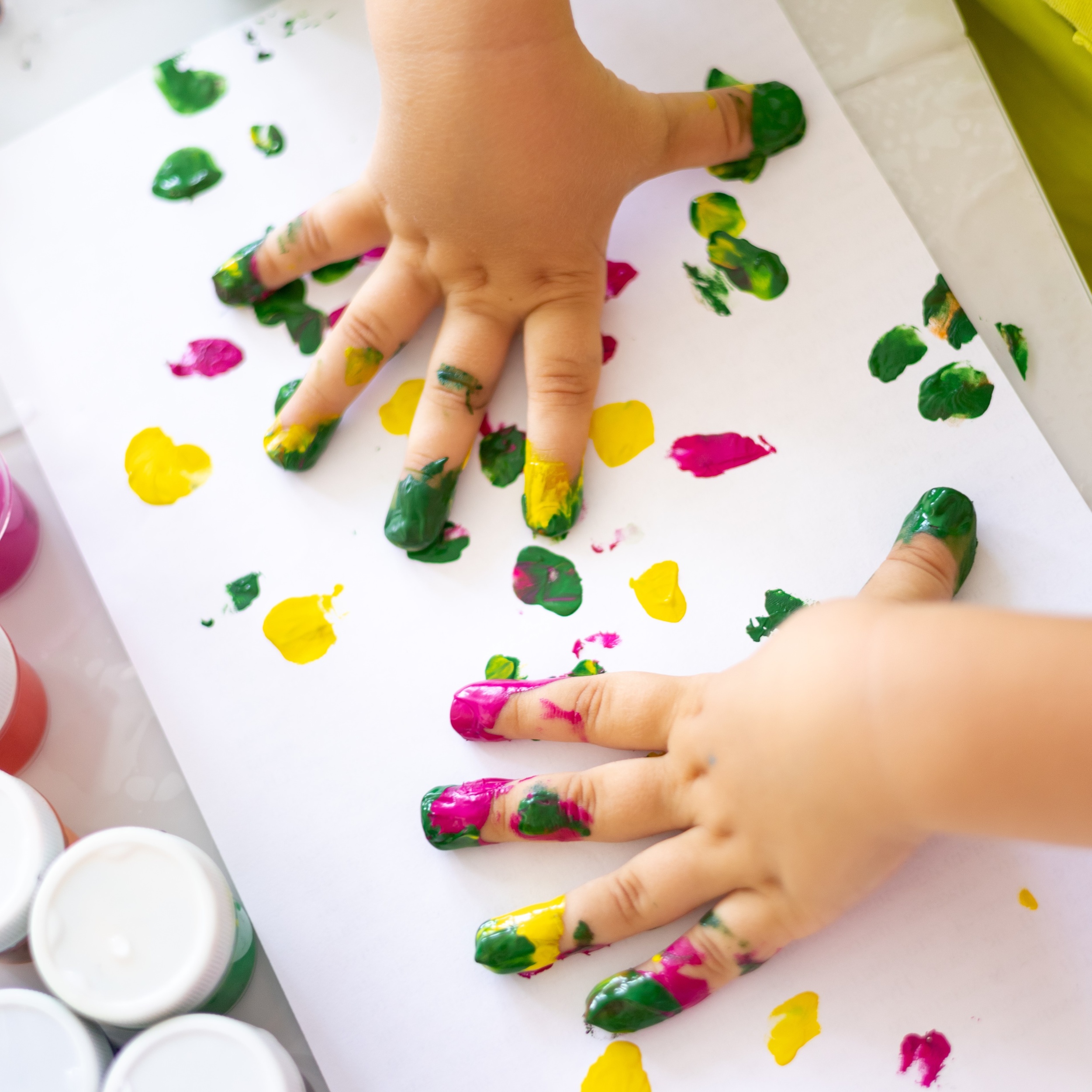 1 children-s-hands-close-up-child-s-fingers-are-drawn-with-colored-paints-white-paper.jpg