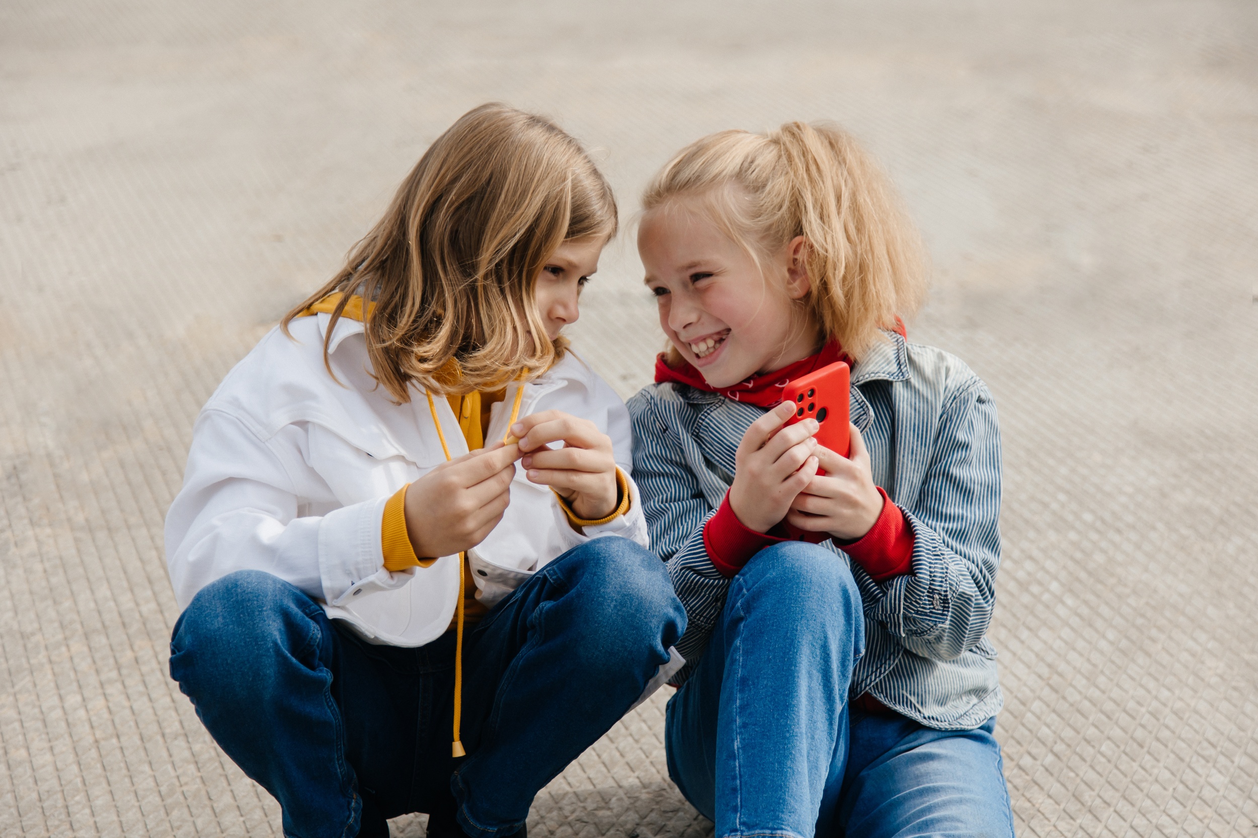 2 preteen-friends-boy-girl-play-smartphone-gadget-together.jpg 2 preteen-friends-boy-girl-play-smartphone-gadget-together.jpg