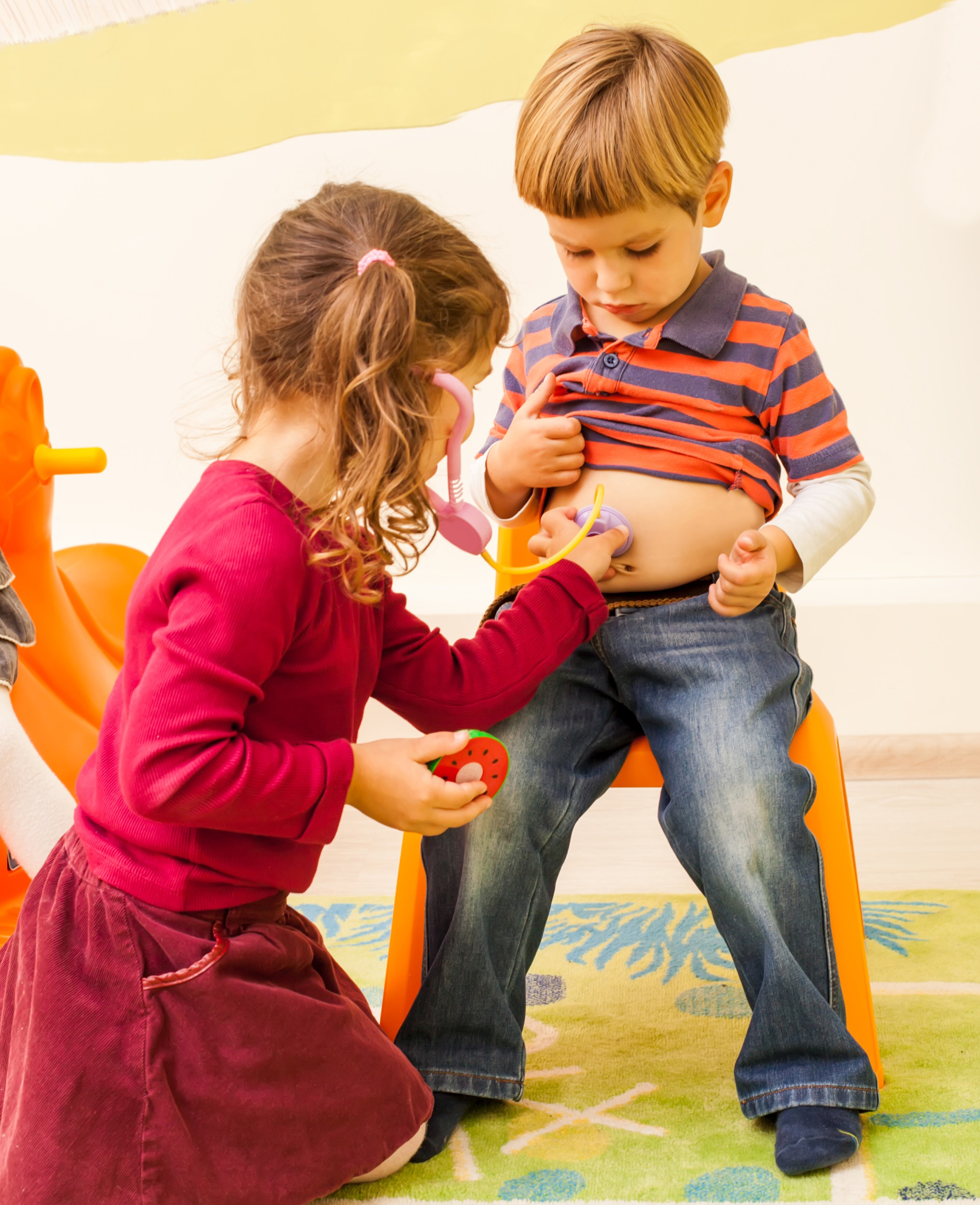 2 girl-with-stethoscope-is-playing-doctor-listening-boy-s-belly.jpg