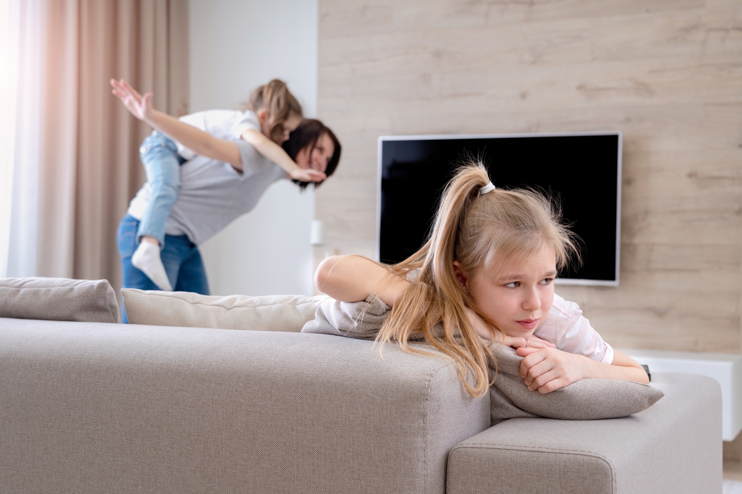 2 preteenage-sad-girl-sitting-couch-while-mother-having-fun-with-sister-jealousy-concept.jpg 2 preteenage-sad-girl-sitting-couch-while-mother-having-fun-with-sister-jealousy-concept.jpg