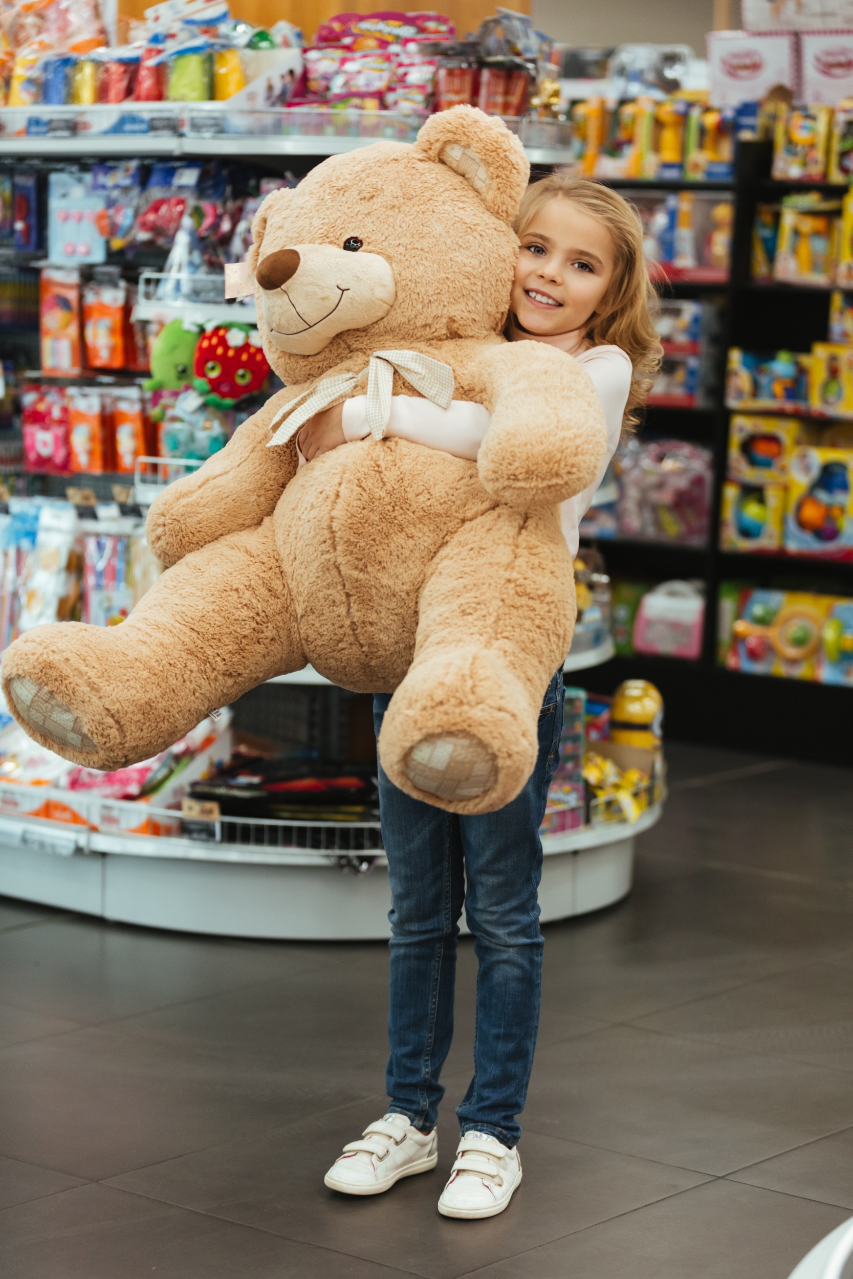 5 happy-little-girl-holding-big-teddy-bear.jpg