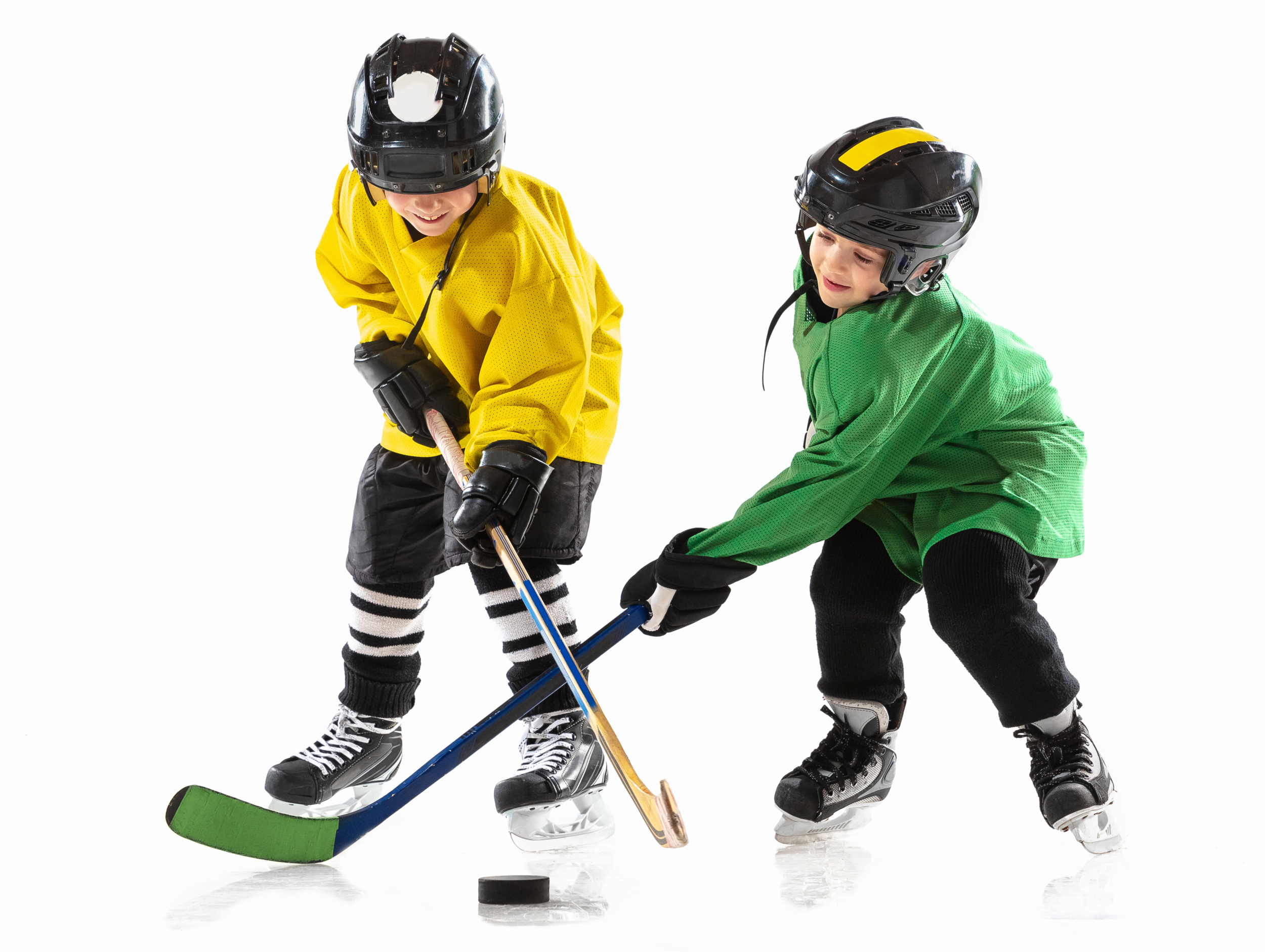 little-hockey-players-with-sticks-ice-court-white-studio-wall.jpg