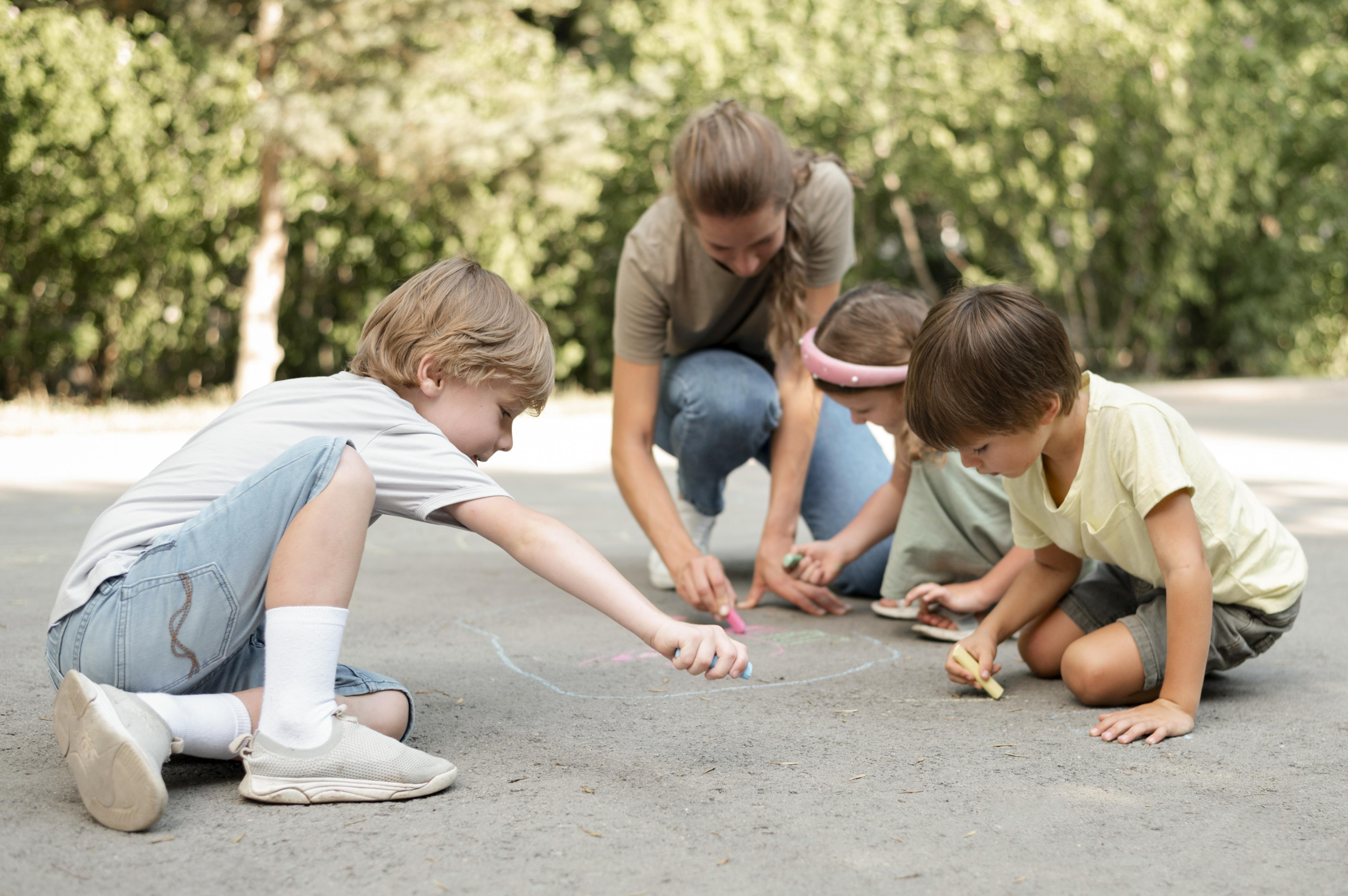 full-shot-kids-drawing-ground.jpg