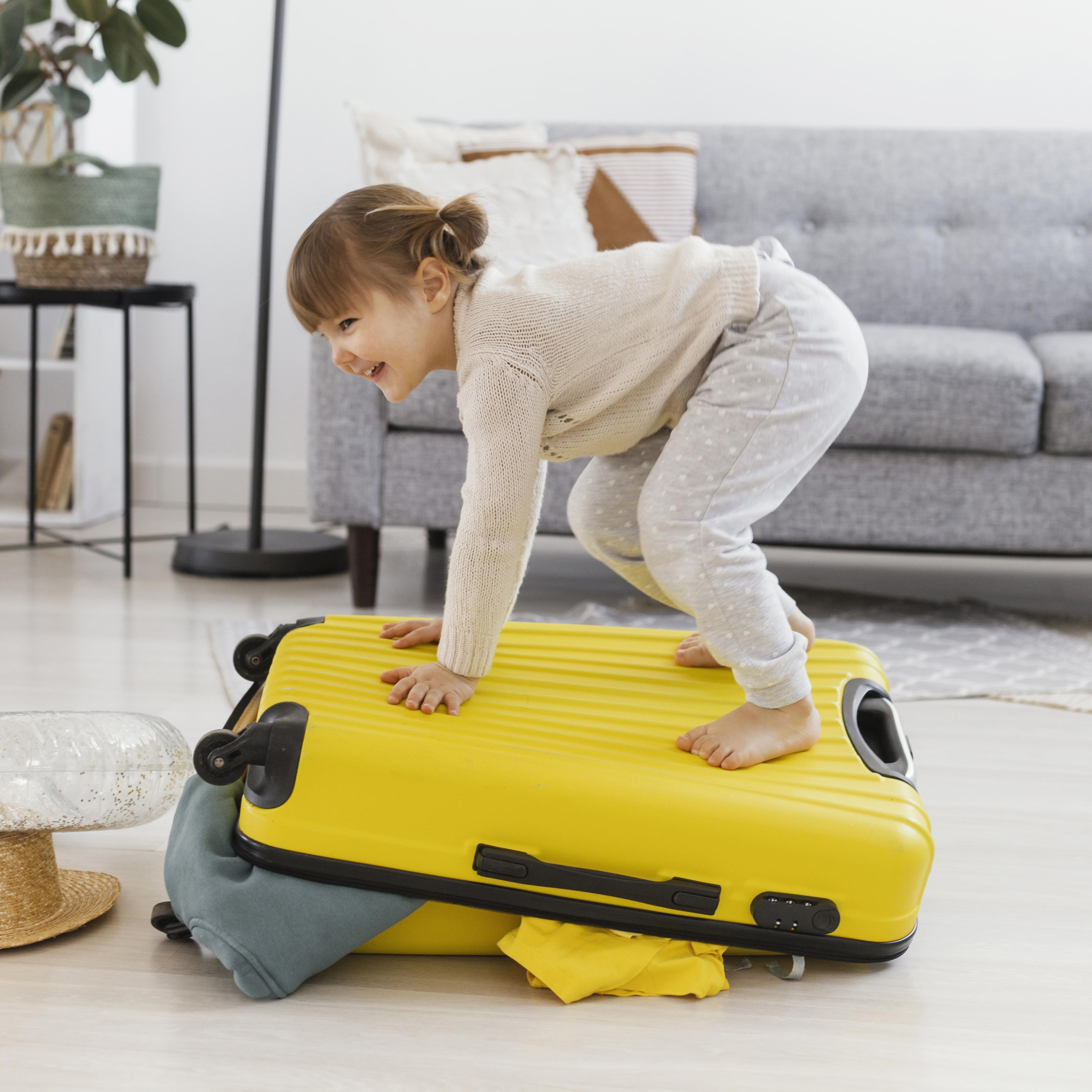 3 full-shot-woman-standing-luggage.jpg