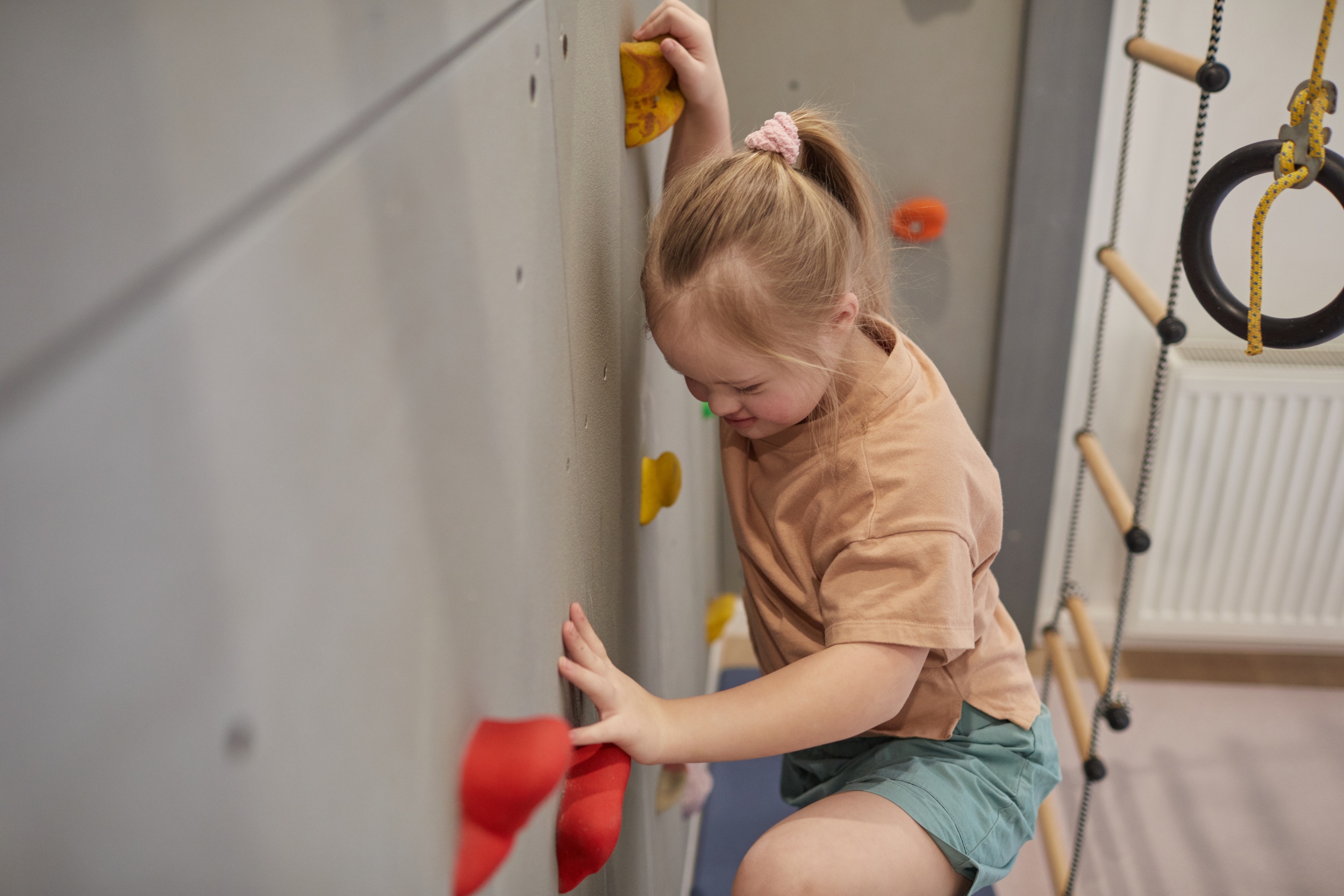 1 girl-with-down-syndrome-climbing-wall.jpg