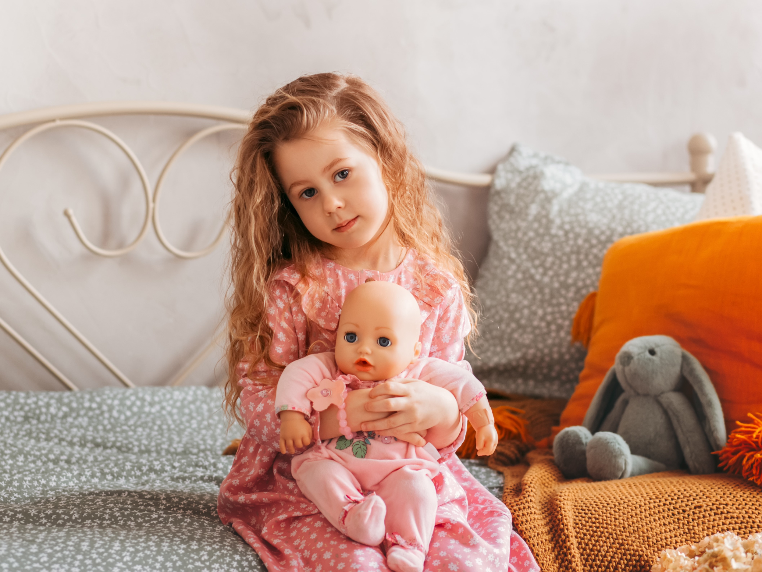 little-cute-girl-with-doll-sits-bed-children-s-bedroom-happy-childhood-cheerful-lifestyle-games-comfortable-pastime-hobby-concept.jpg