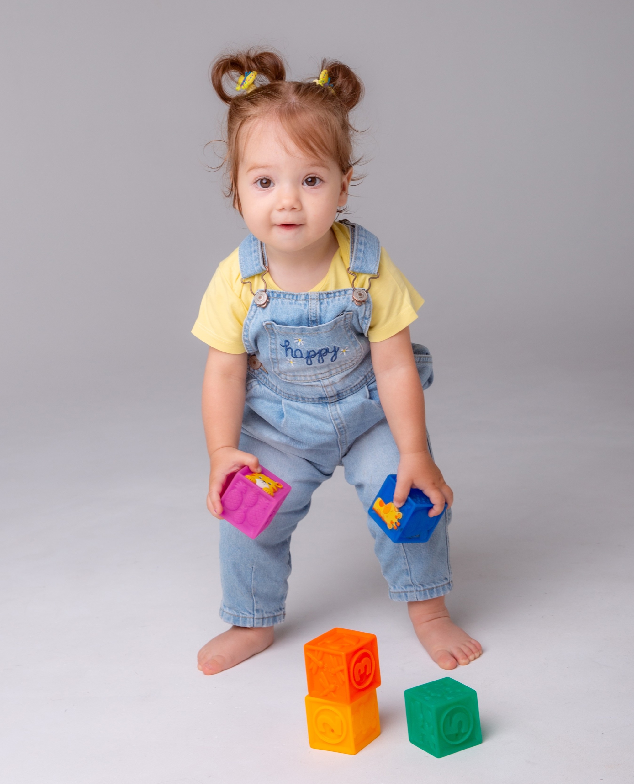 1 little-baby-girl-is-white-background-playing-with-colorful-cubes-kid-s-play-toy-cubes.jpg