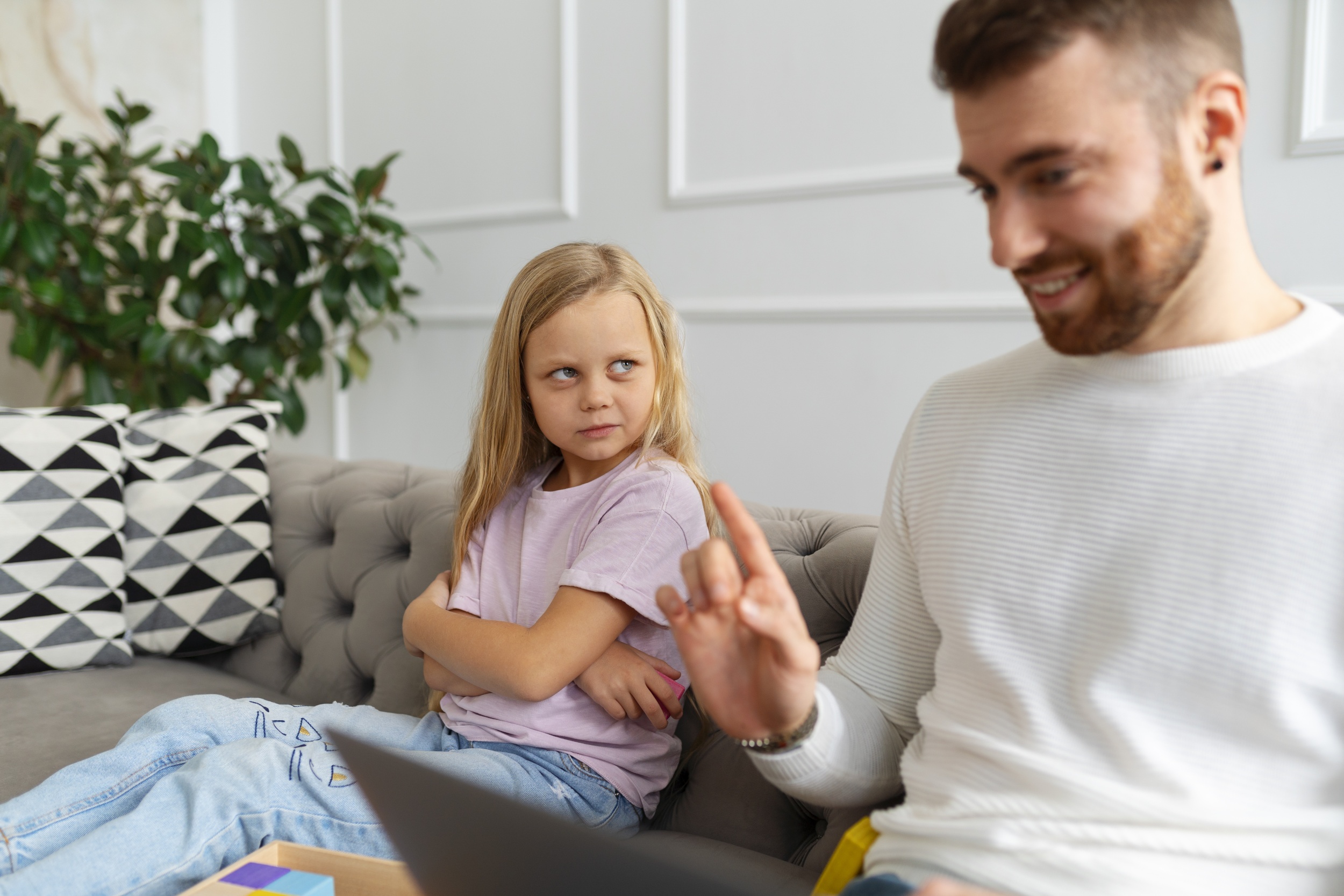 3 side-view-father-kid-sitting-couch.jpg