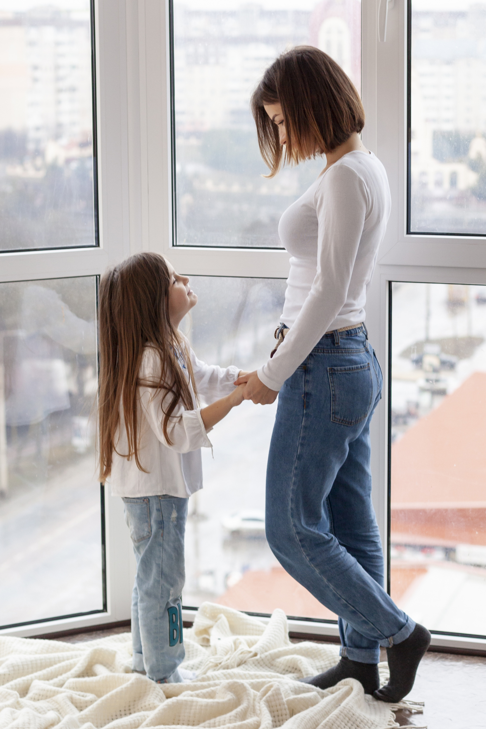 side-view-mom-daughter-holding-hands.jpg